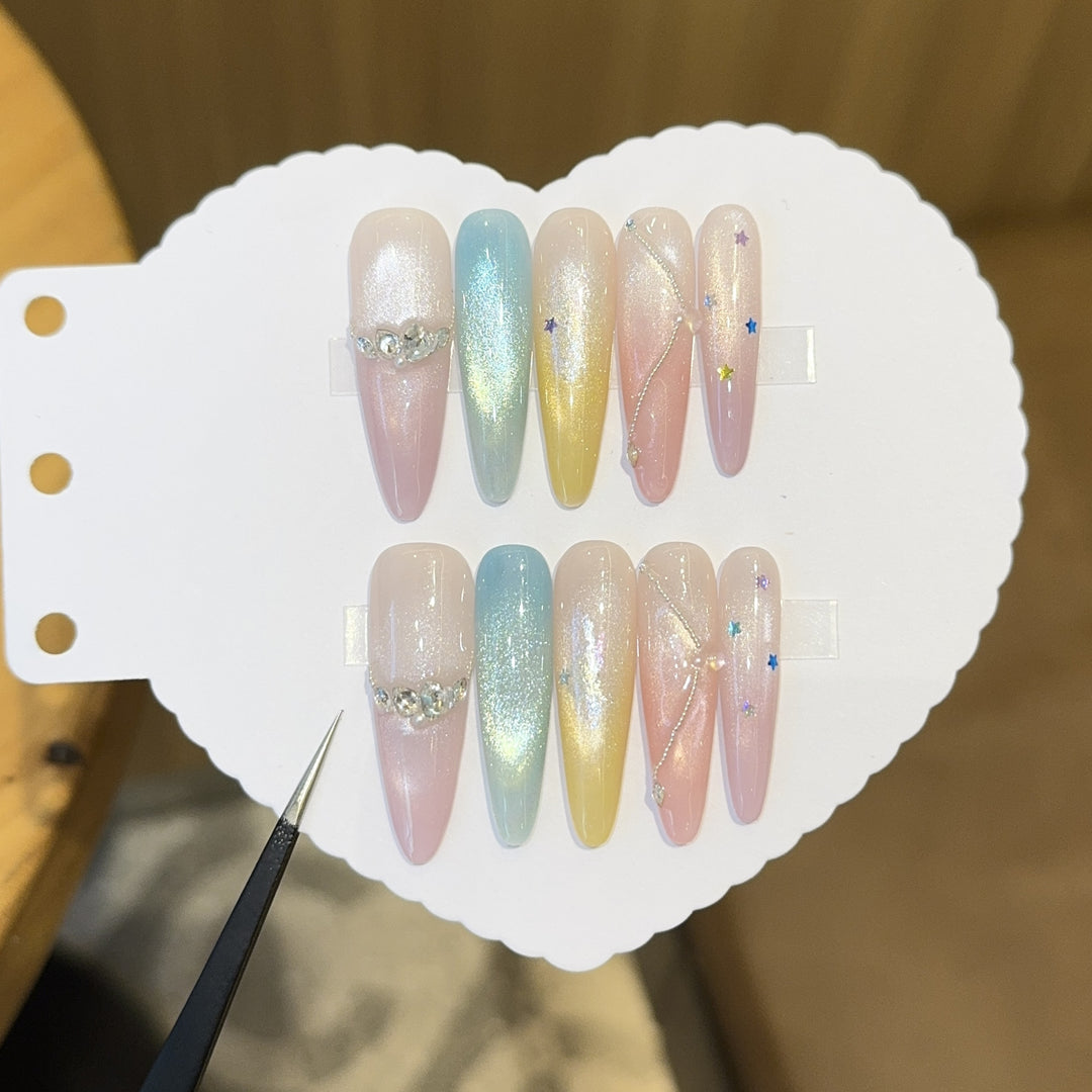 Artificial nails with shimmering effects and sparkling rhinestone details Stornfield