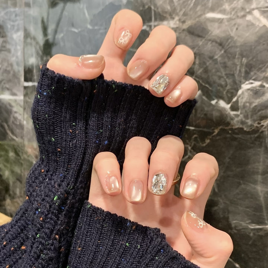 Elegant artificial nails with shimmering glitter and floral details Stornfield