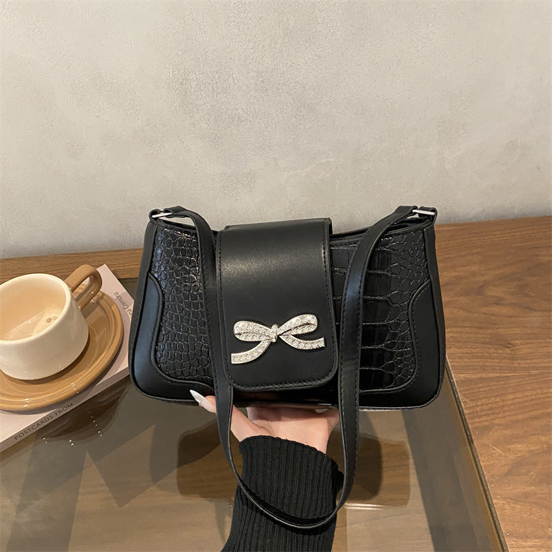 Elegant Crocodile-Patterned Handbag with Bow Detail