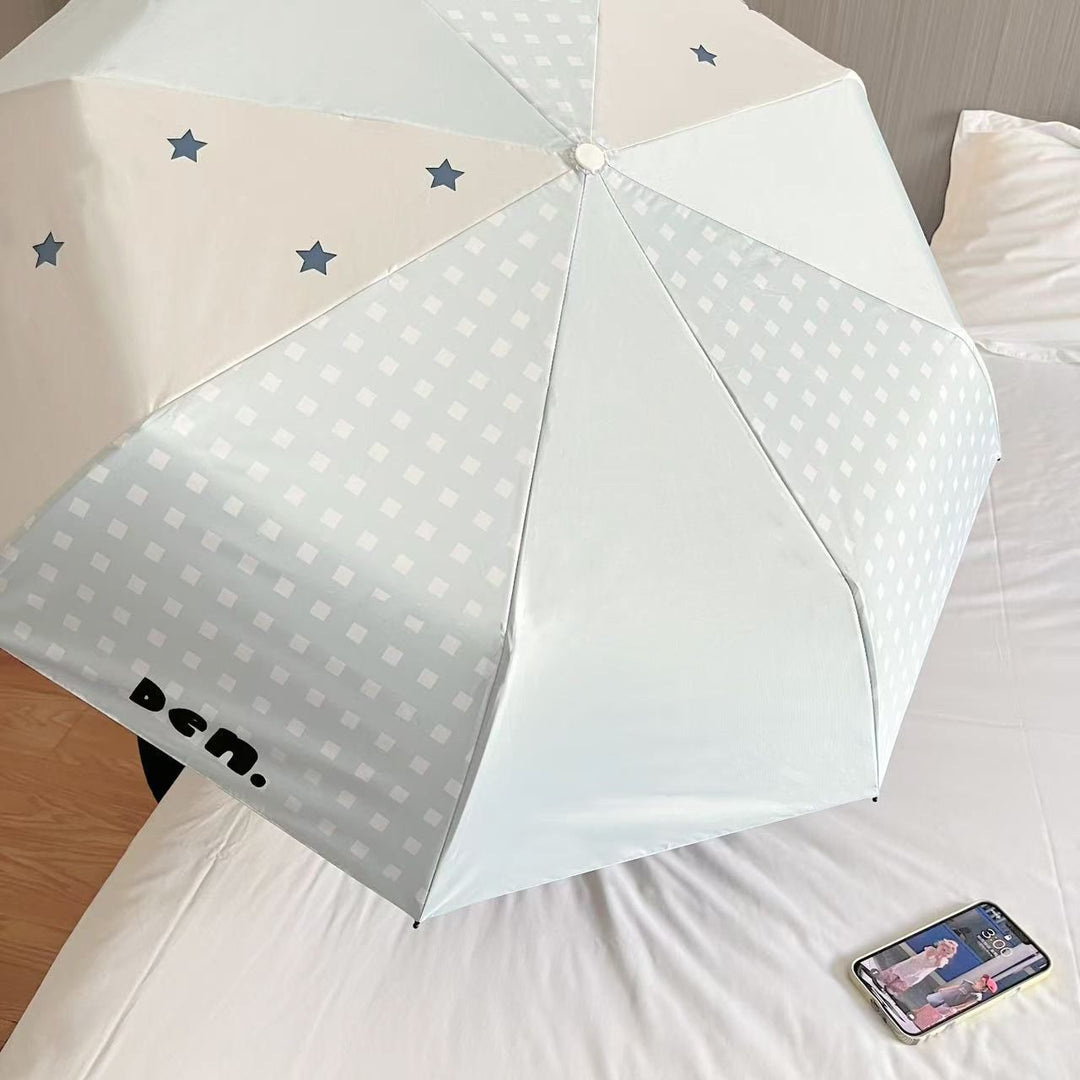 Women's folding umbrella with unique star pattern and practical carrying bag Stornfield