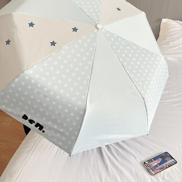 Women's folding umbrella with unique star pattern and practical carrying bag Stornfield