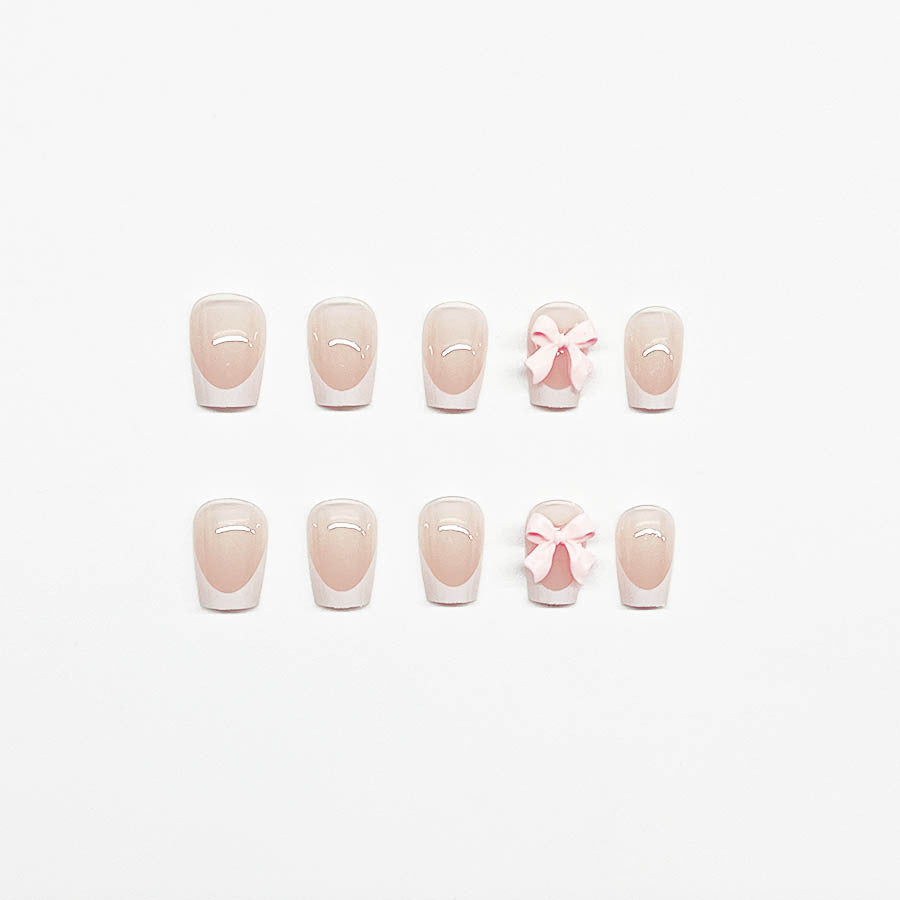 Decorative French Tip Nail Extensions with Bow Accents Stornfield