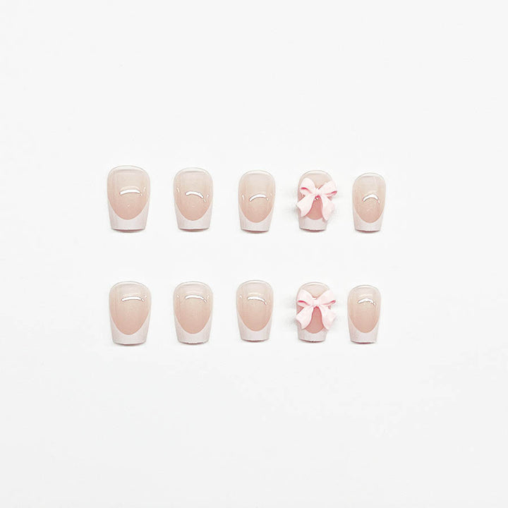 Decorative French Tip Nail Extensions with Bow Accents Stornfield