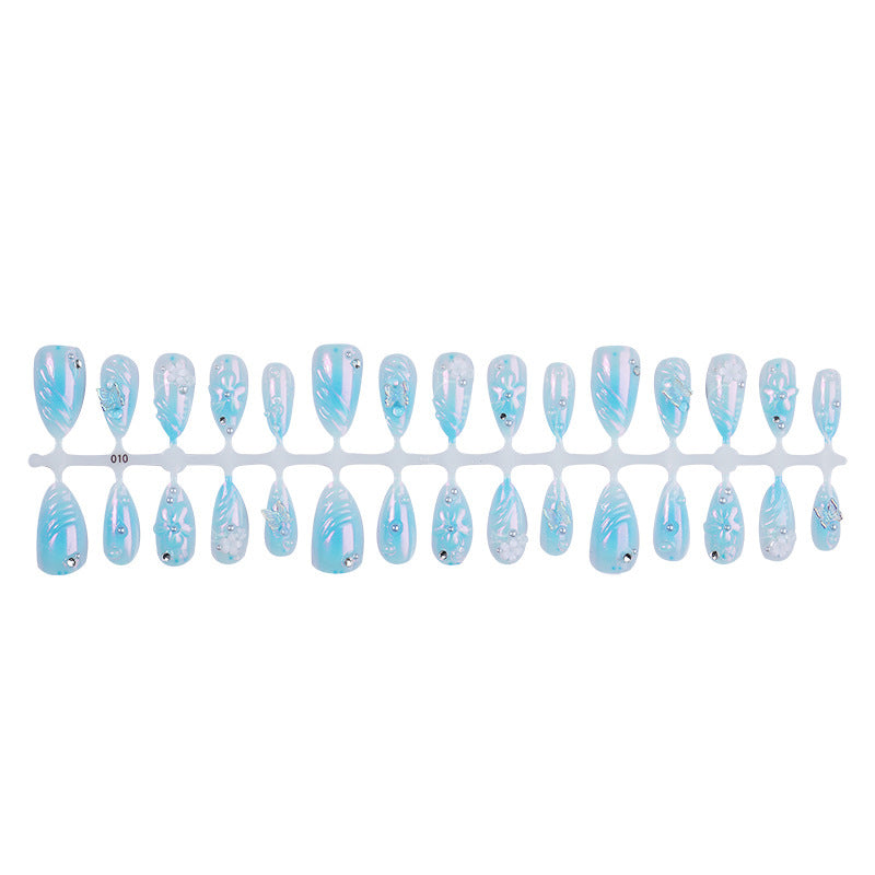 Creative nail set with floral accents and glittering details Stornfield