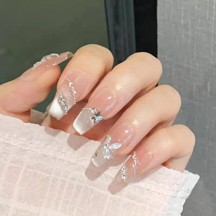 Artificial nails with glamorous decorations and shine Stornfield