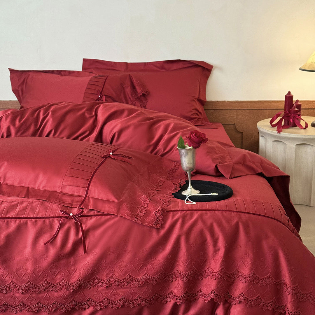 Romantic satin bedding set with lace trim, pleated detail and satin bows