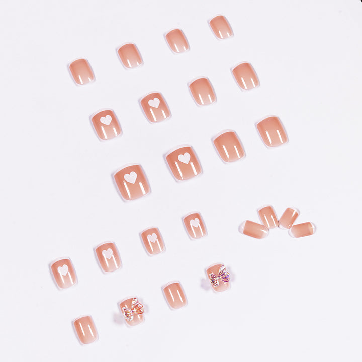 Nail art with heart and butterfly motifs Stornfield