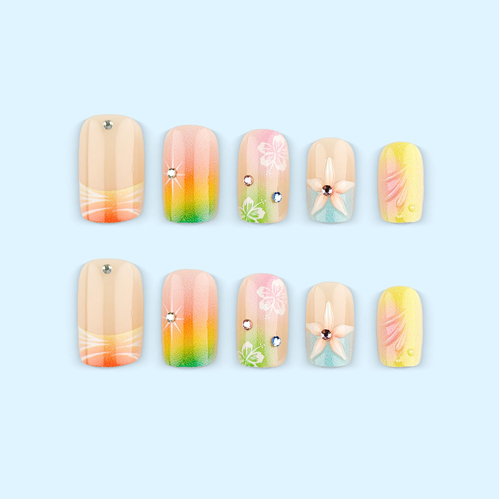 Artificial nails in vibrant floral design with glitter accents Stornfield