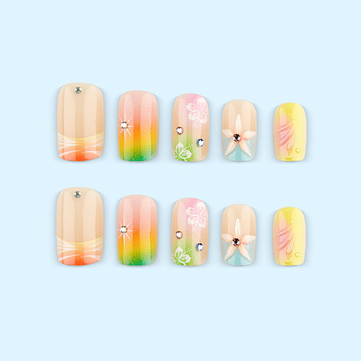 Artificial nails in vibrant floral design with glitter accents Stornfield