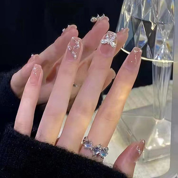Glamorous glitter artificial nails with butterfly element Stornfield