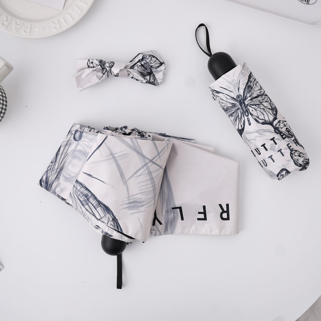 Women's fashionable folding umbrella with playful design Stornfield