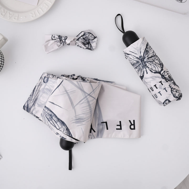 Women's fashionable folding umbrella with playful design Stornfield