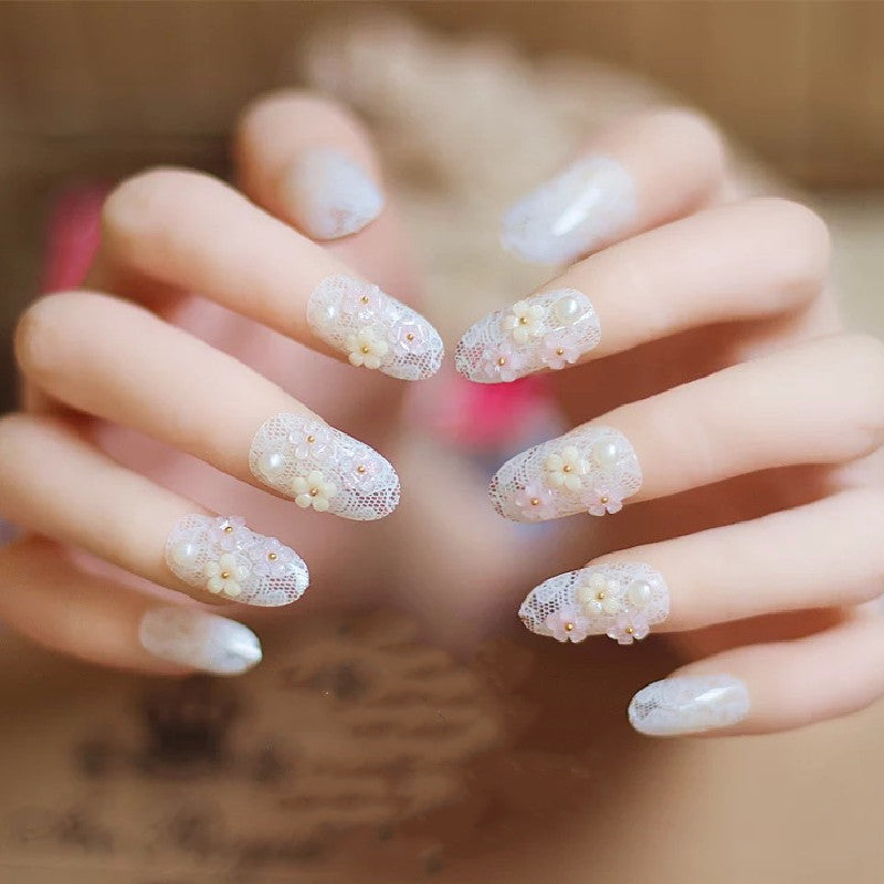 Artificial nails with delicate floral decorations Stornfield