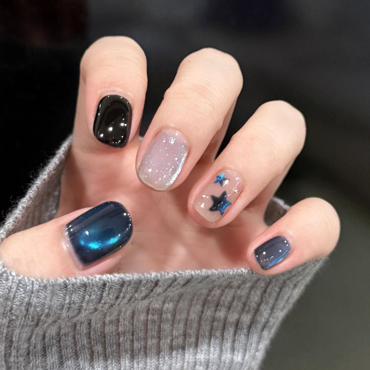 Artificial nails with elegant star design and shimmering effects Stornfield