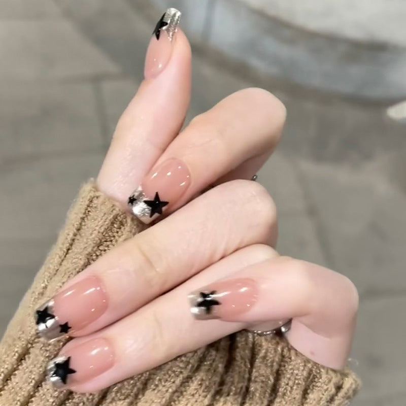 Sparkling nail art with stars and glitter accents Stornfield