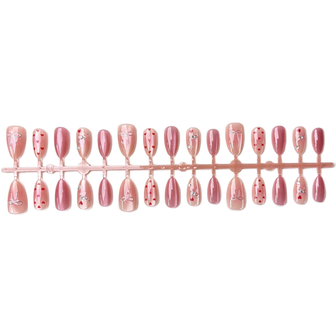 Nail art set with romantic hearts and elegant bows Stornfield