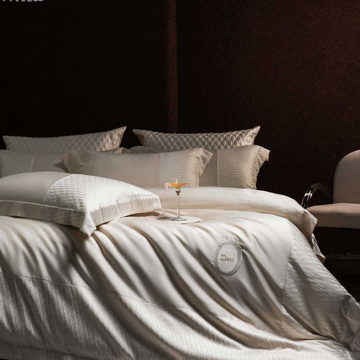 Luxurious satin bedding set with jacquard trim and embroidered coat of arms