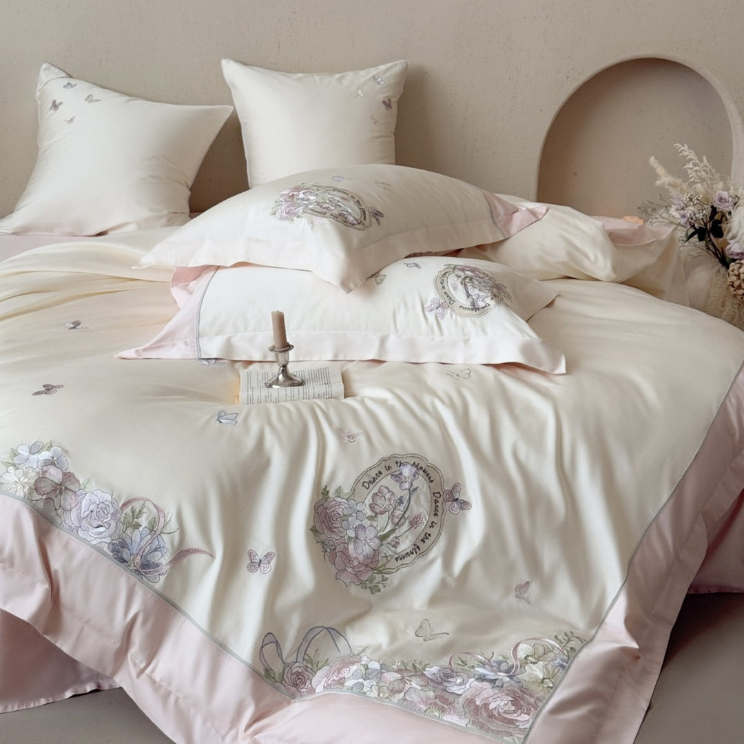 Luxurious floral embroidered cotton satin bedding set with ruffle and decorative pillow Stornfield