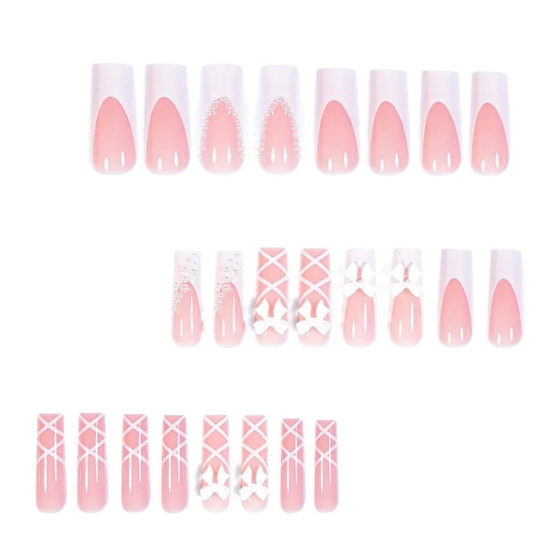 Artificial nail set with elegant 3D bows and pearl embellishments Stornfield
