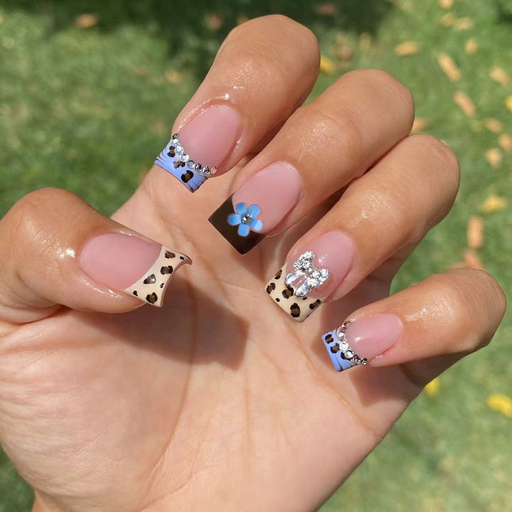 Artificial nails with stylish animal patterns and sparkling accents Stornfield