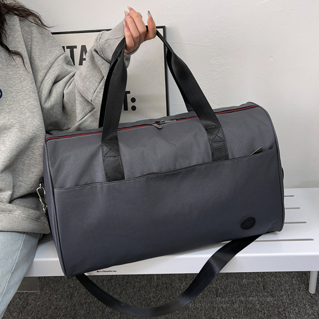 Sporty travel bag with sturdy carrying handles and removable shoulder strap Stornfield