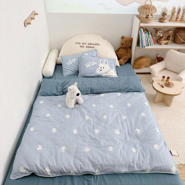 Children's bedding set in futon style with embroidered puppy motifs and cuddle pillow