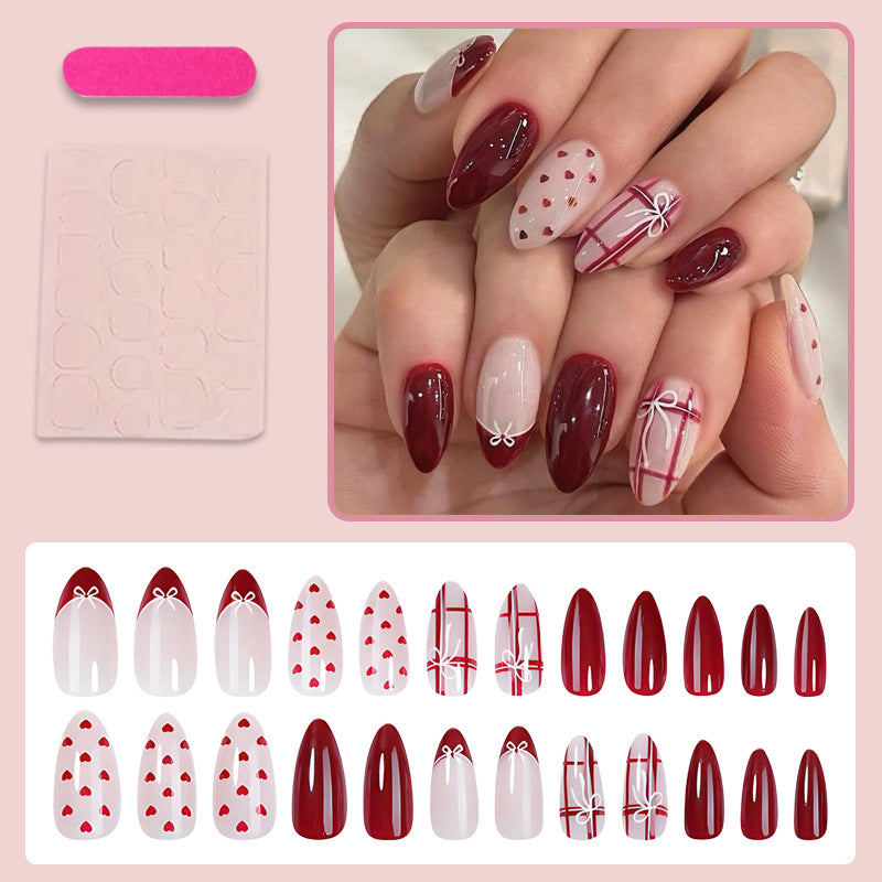 Nail set with playful hearts and elegant bows Stornfield