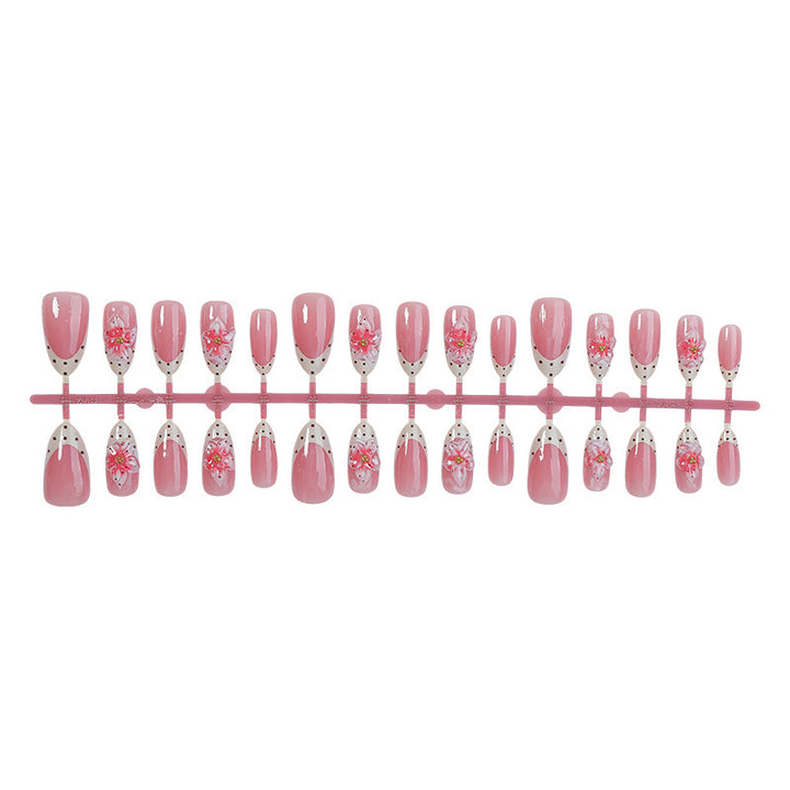 Nail art set with floral designs and glitter accents Stornfield