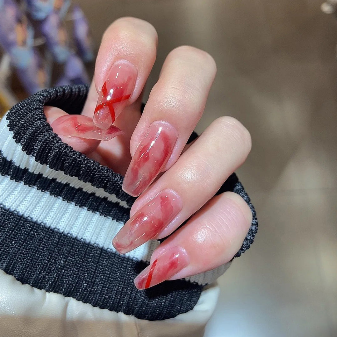 Artfully designed acrylic nails with marbled and decorative effects Stornfield