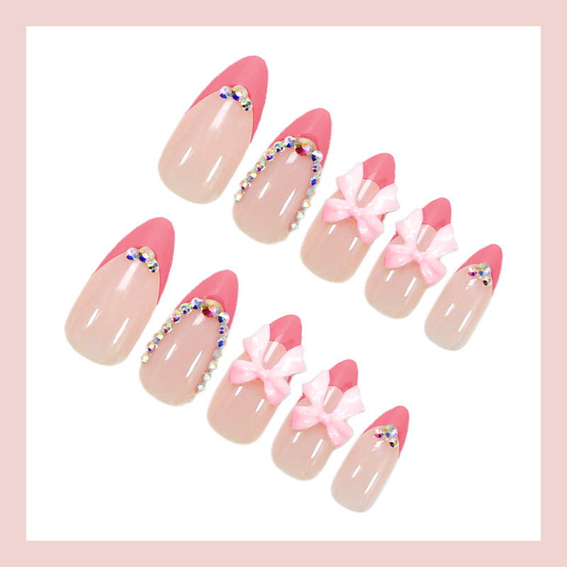 Artificial nail set with playful floral decorations and elegant glitter accents Stornfield