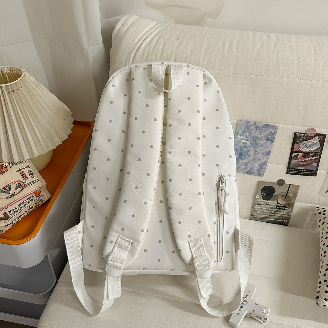 Polka Dot Patterned Backpack with Playful Wing Accents Stornfield