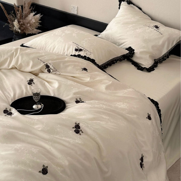 Luxurious cotton satin bedding set with lace border and rose embroidery