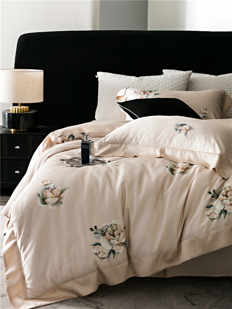 Duvet cover set made of cotton satin with subtle watercolor flower print and silky-matte texture