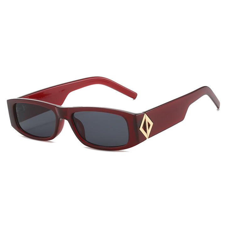Ladies fashionable sunglasses with asymmetrical frame and gold-colored details Stornfield