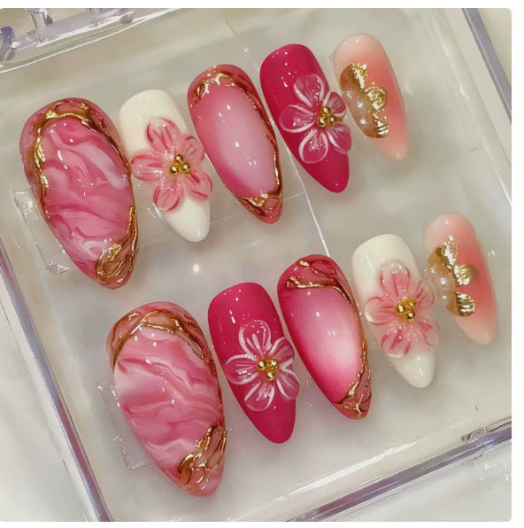 Acrylic nail set with floral accents and glitter details Stornfield