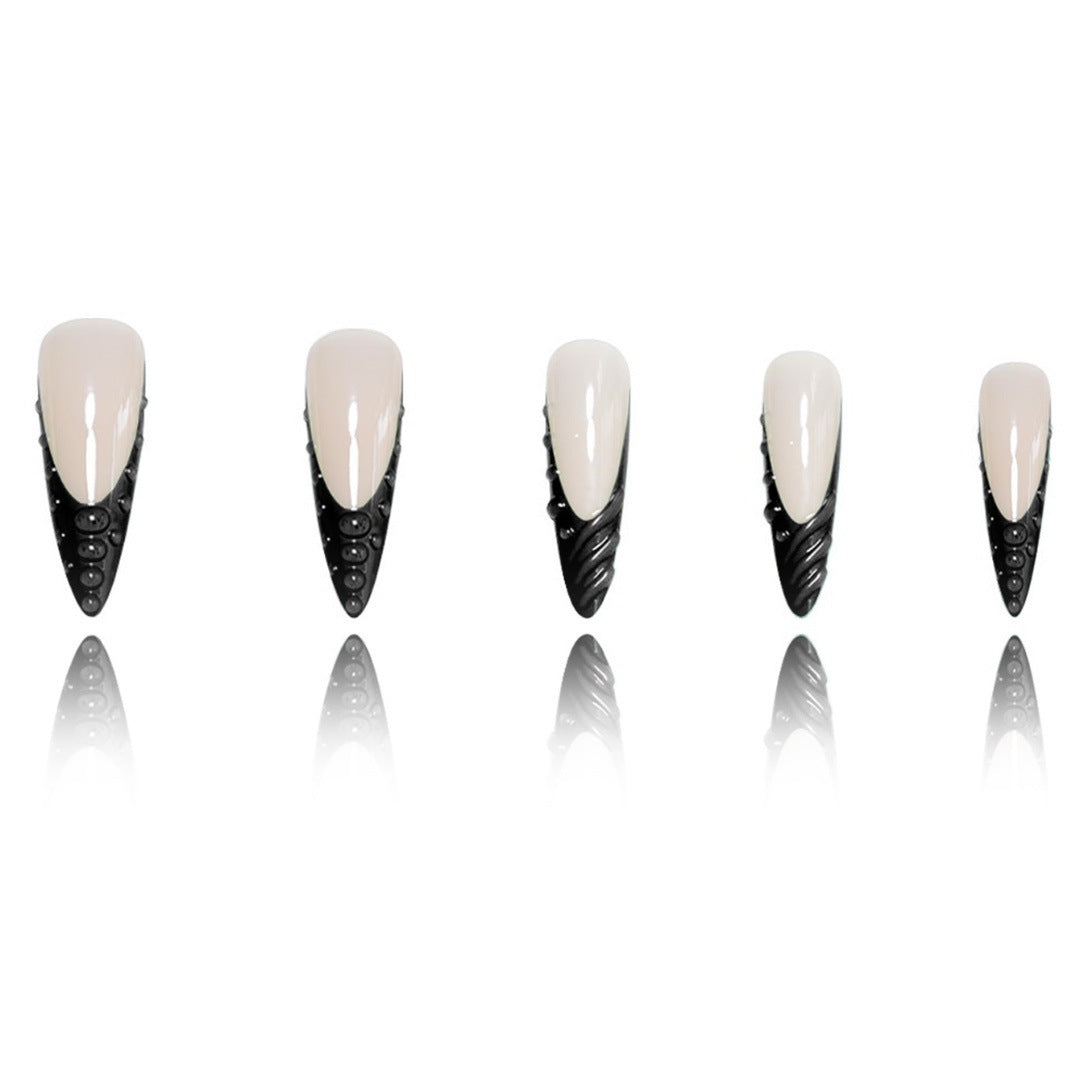 Artistic Stiletto Nail Extensions with Textured Detailing Stornfield