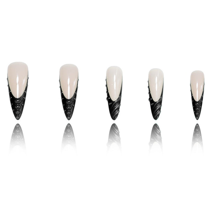 Artistic Stiletto Nail Extensions with Textured Detailing Stornfield