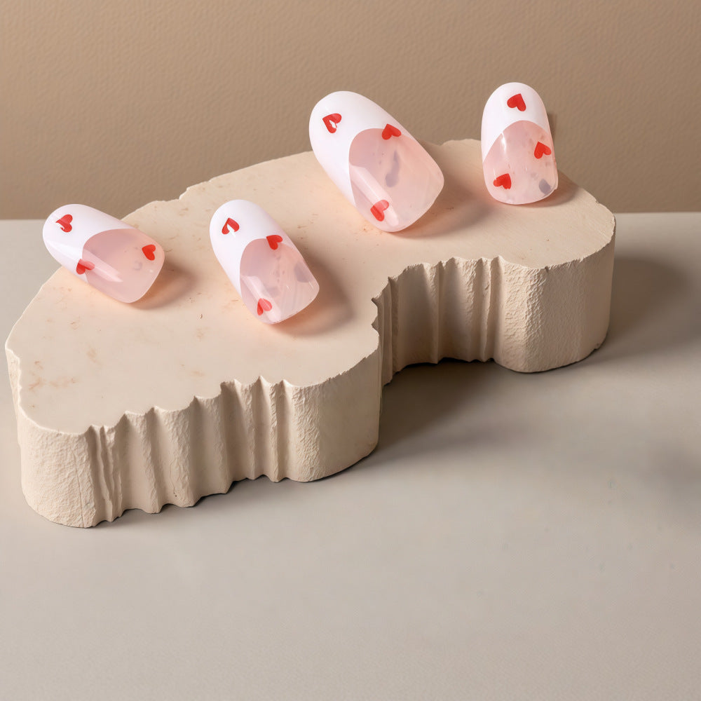 Artificial nails with romantic heart decorations Stornfield