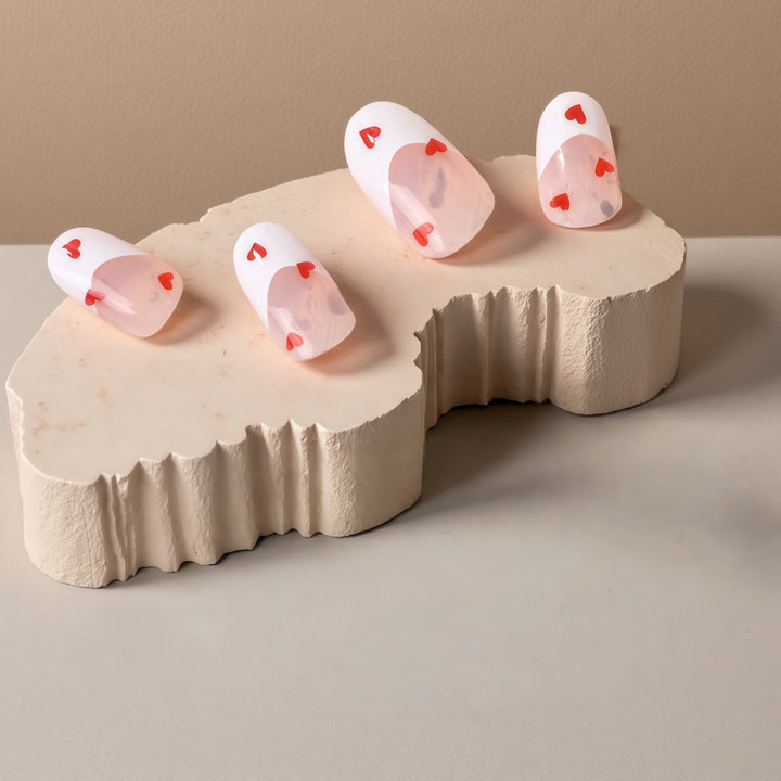 Artificial nails with romantic heart decorations Stornfield