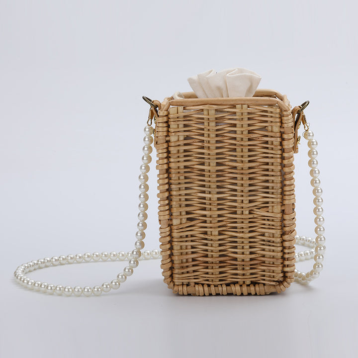 Women's handbag made of woven material with pearl accents Stornfield