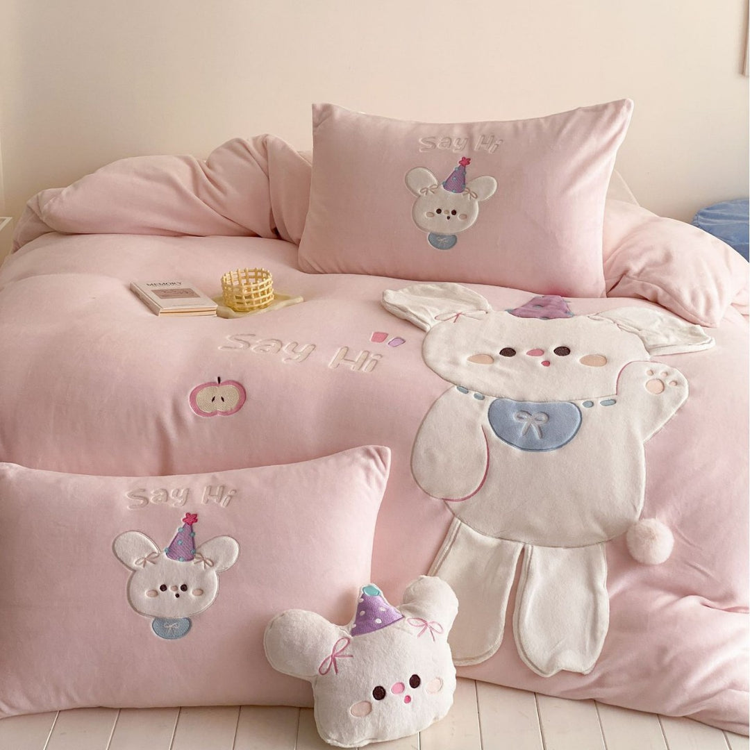 Children's bedding set with appliquéd cuddle bunny, quilted blanket and decorative pillows
