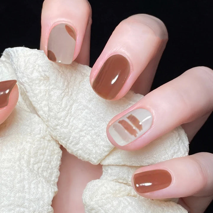 Artful nail extensions with an elegant leaf pattern Stornfield