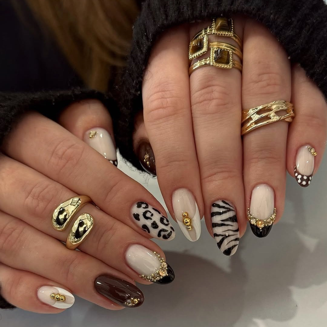 Acrylic nail set with luxurious animal motif designs and glamorous accents Stornfield