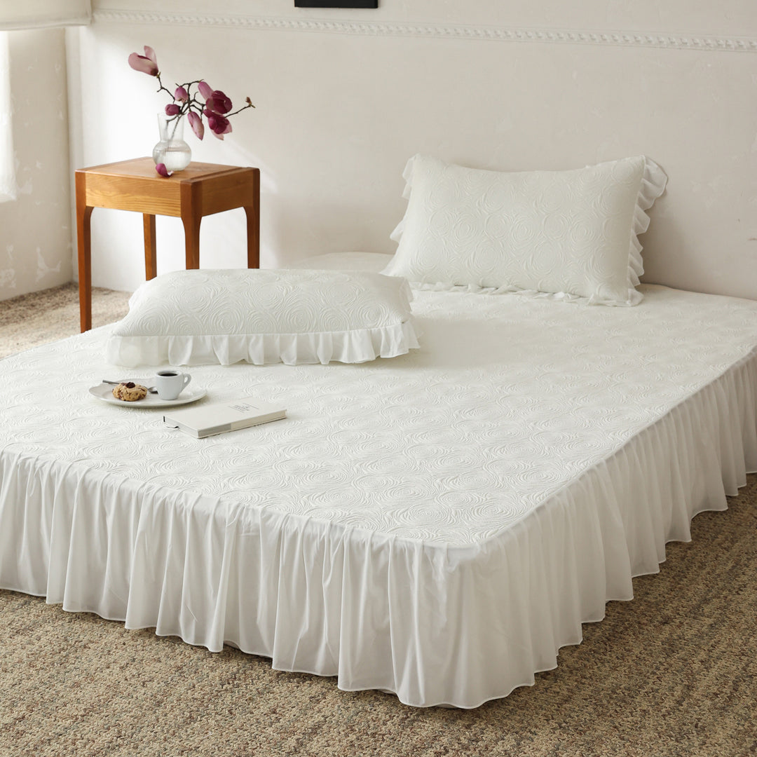 Bedding set with quilted mattress topper and ruffled skirt