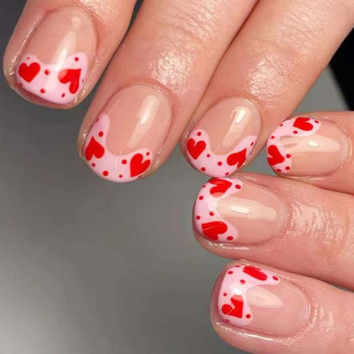 Artfully designed nail tips with heart motifs Stornfield