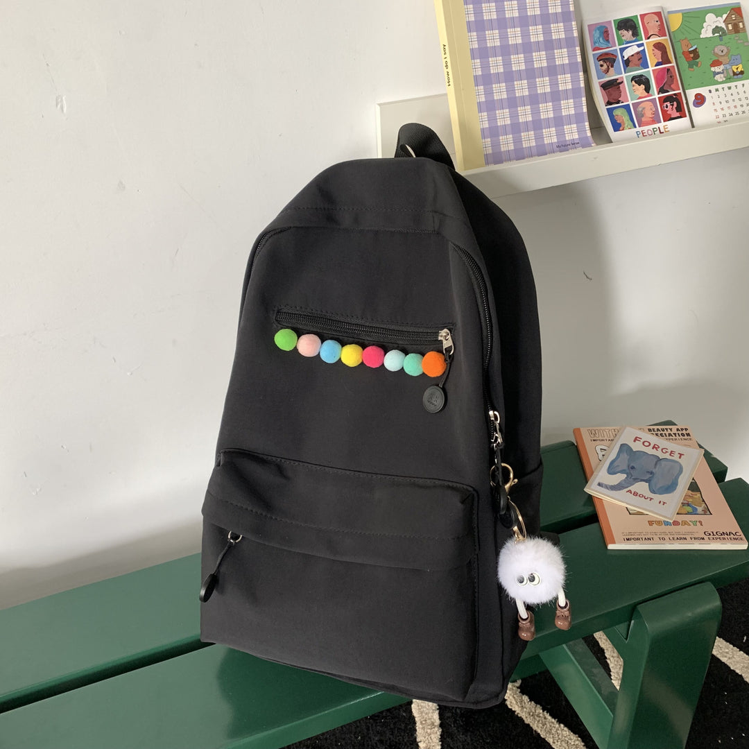 Practical backpack with colorful applications Stornfield
