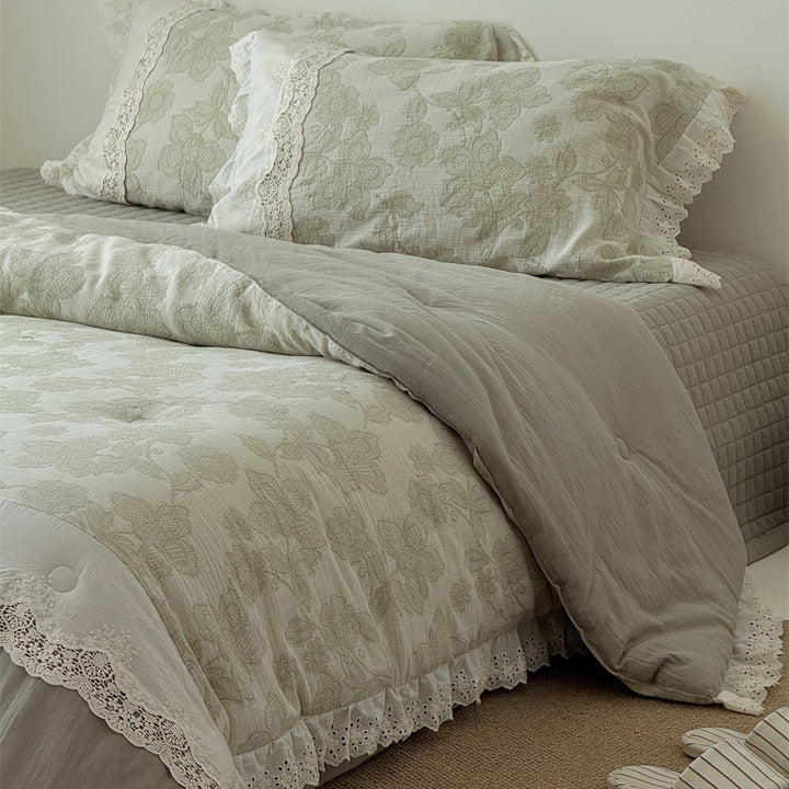 Vintage cotton bedding set with lace trim and hand-drawn floral pattern