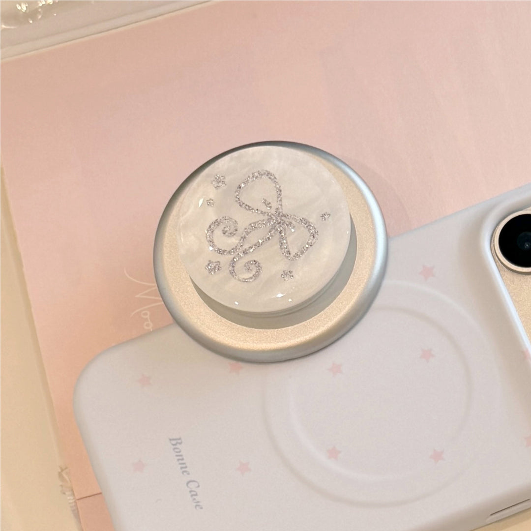 Stylish smartphone finger holder with glitter bow design Stornfield