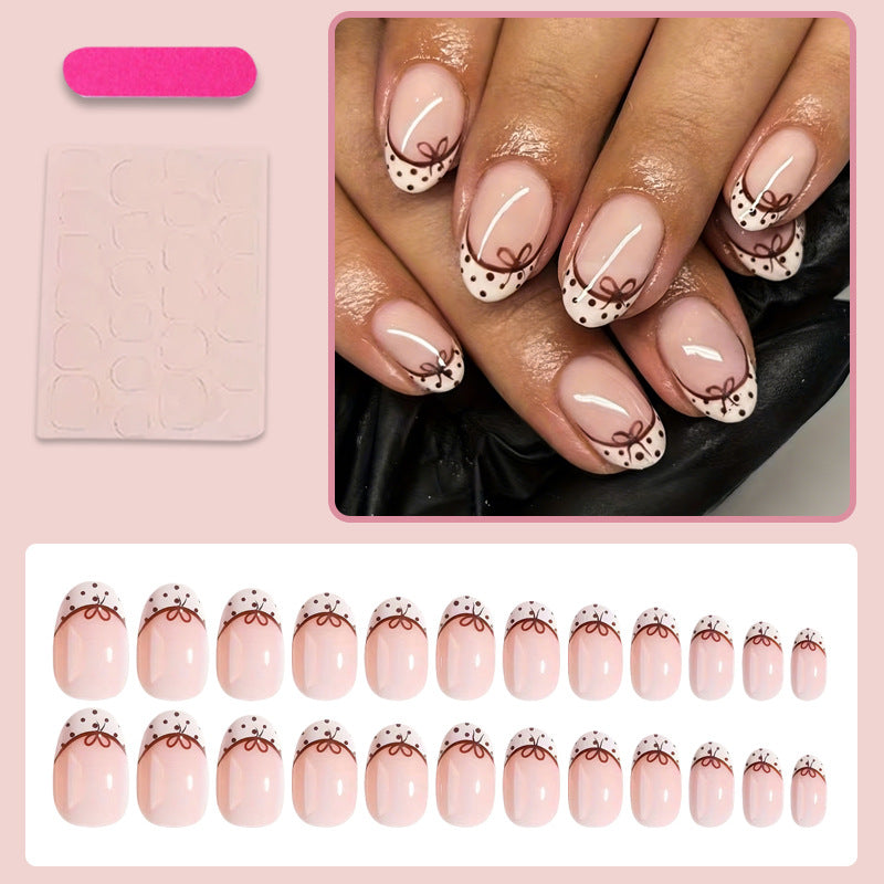 Artificial nail set with elegant bow and dot patterns Stornfield