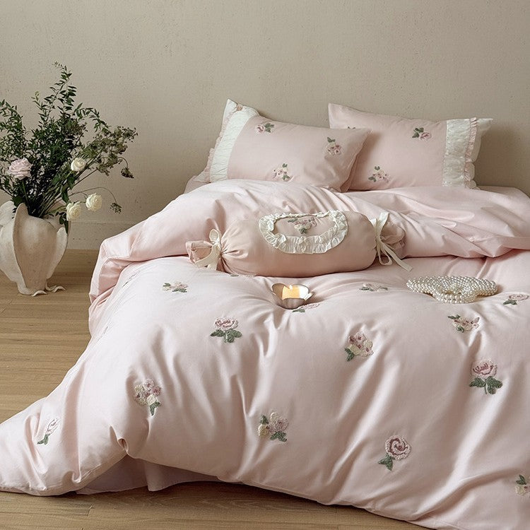 Luxurious cotton bedding set with delicate rose embroidery and ruffles